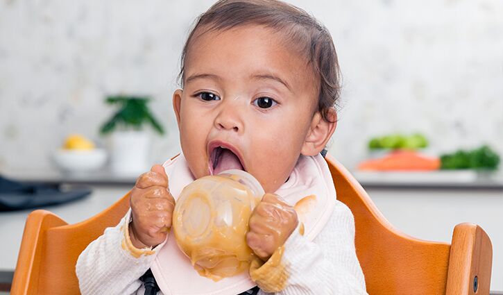 Spoon Feeding Breastmilk to a Newborn 